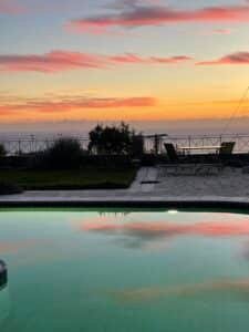 Amenities image depicting a sunset over the pool